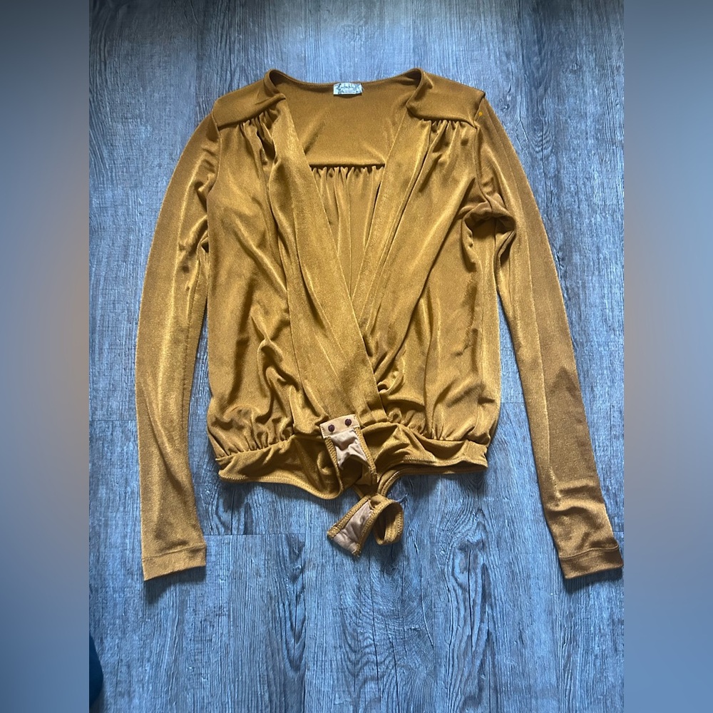Long-sleeved bodysuit from the Free People brand, model Turnt Thong Bodysuit